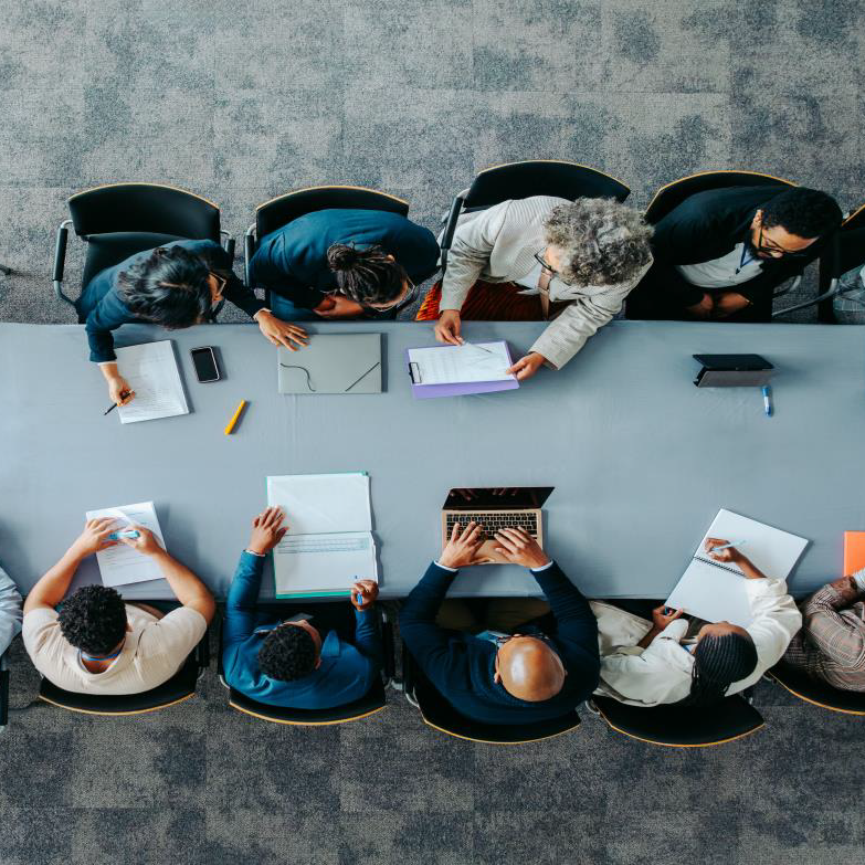 Aerial view of a group of people meeting around a table