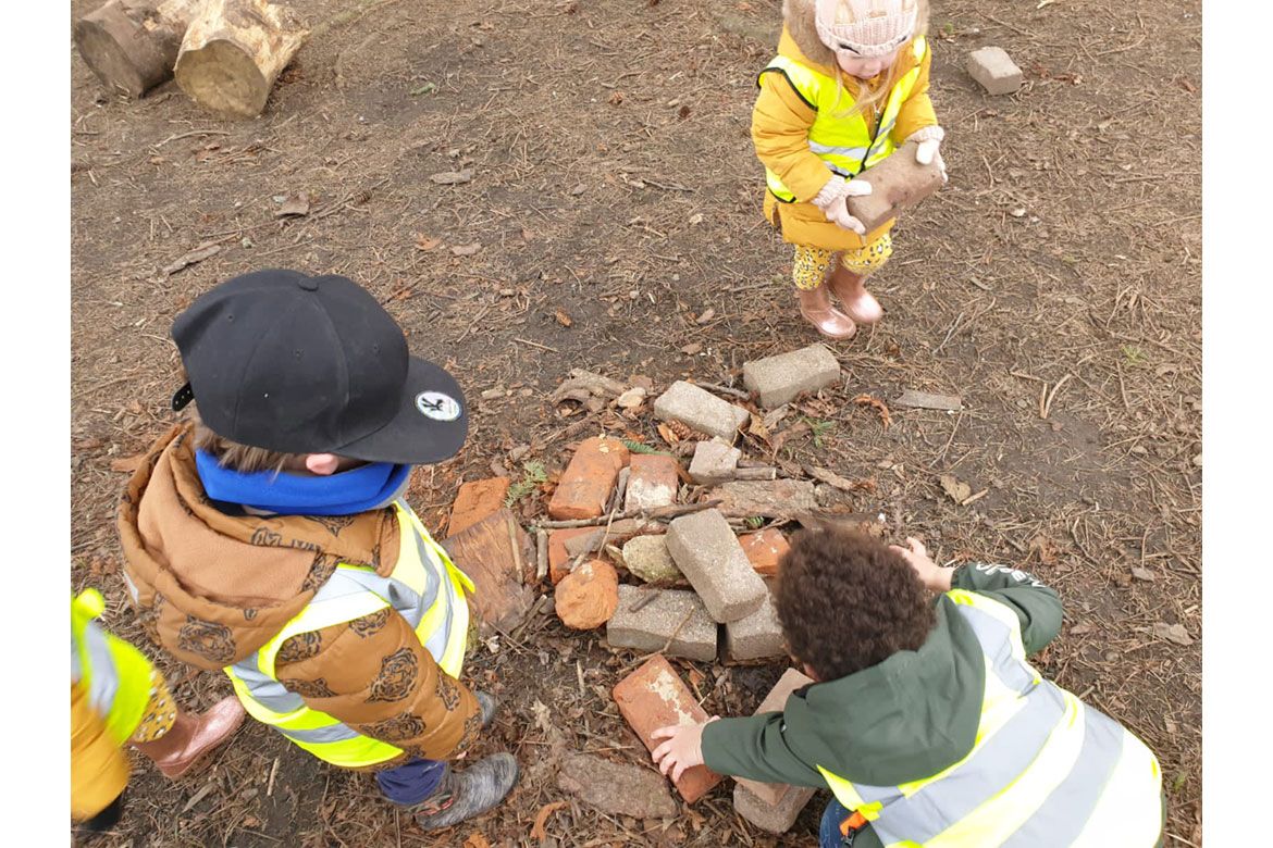 Nursery children playing with bricks