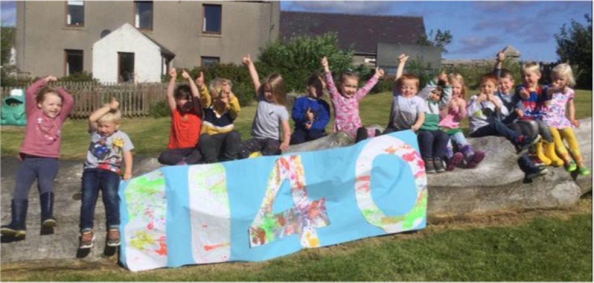 Children with 1140 banner