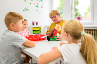 Three children with therapist